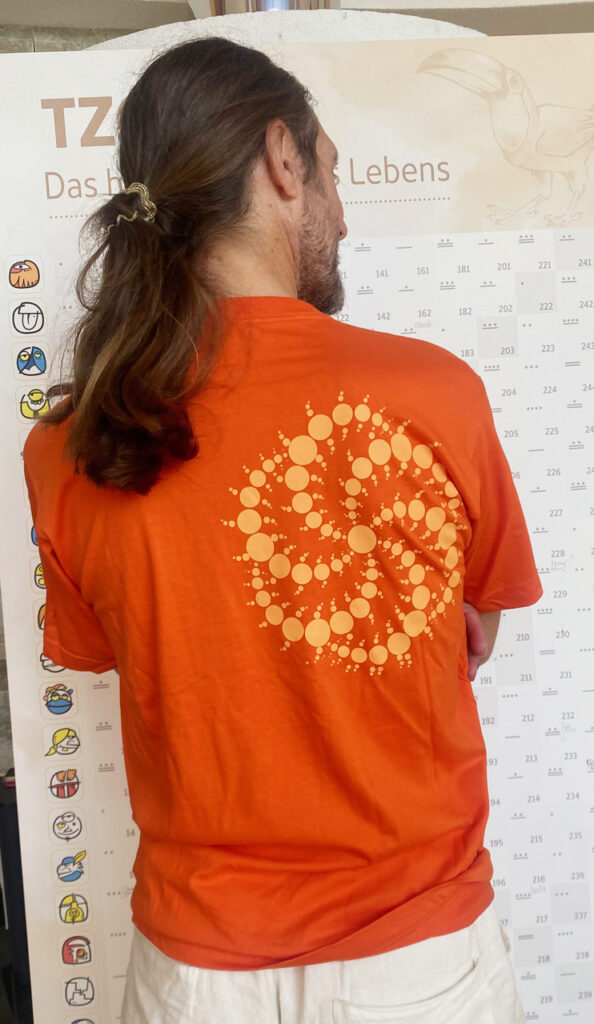 CropShirt orange mit gesticktem Kornkreis "Galaxy" als Brustbild